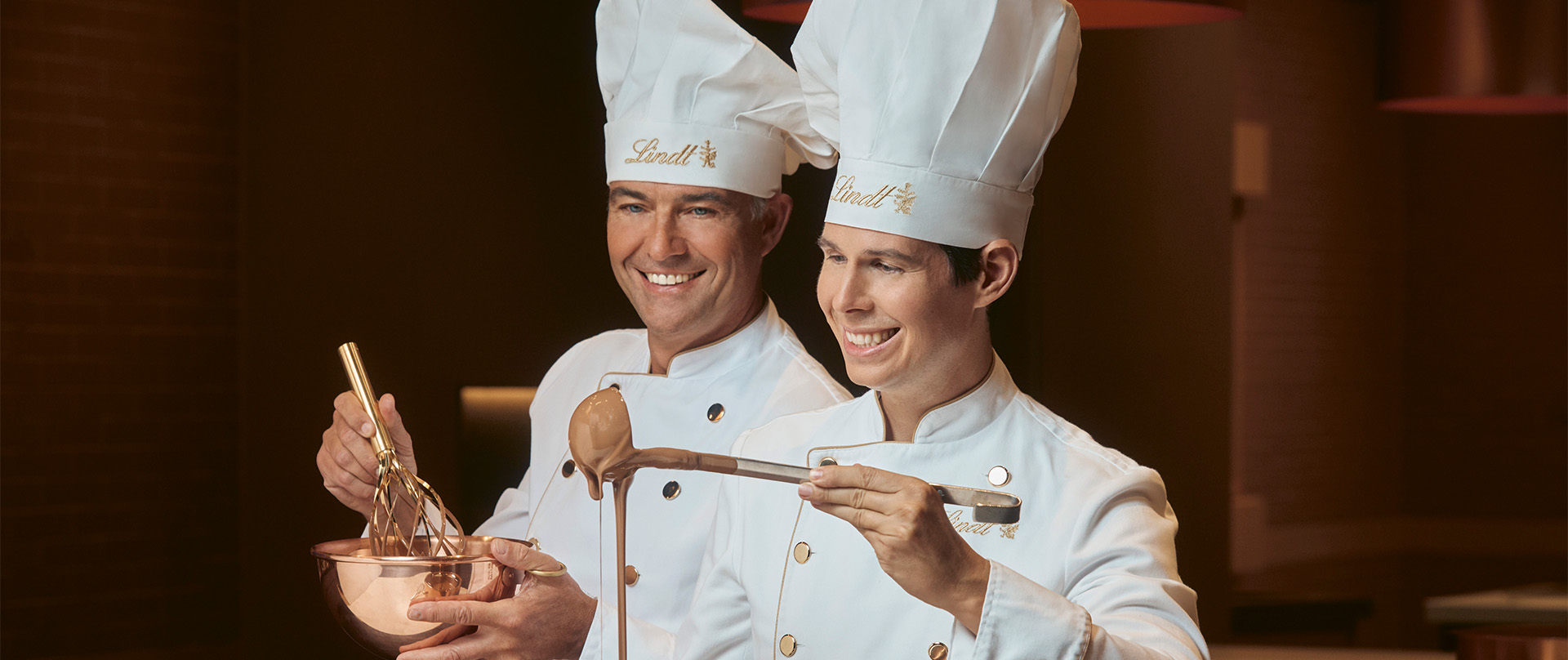Two maîtres chocolatiers preparing chocolate (Photo)